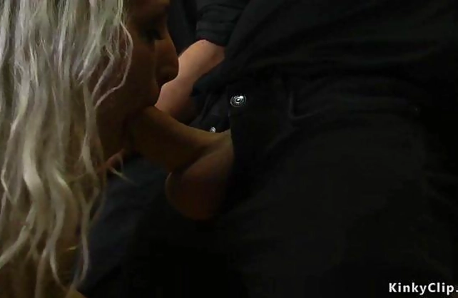 Tied up and naked girl analyzed by two sexy masters for crowd's pleasure