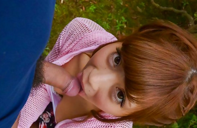 Asian boy coaxes beautiful naked girl to give him blowjob in park