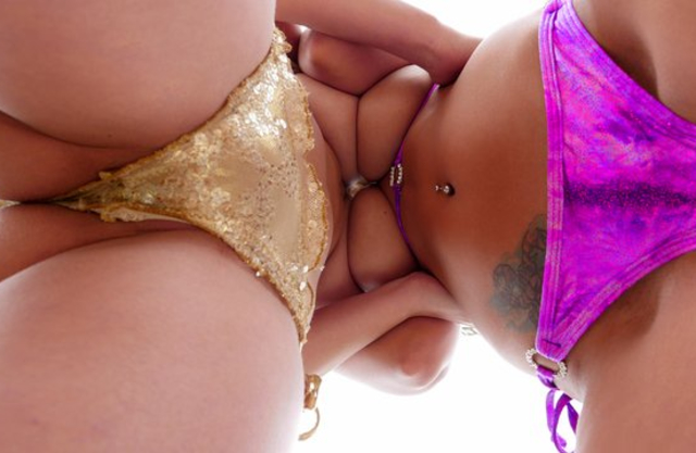 Two hotties with oiled up naked boobs take part in great threesome