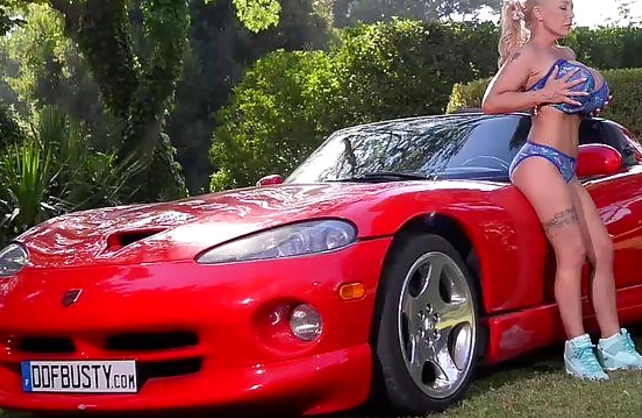 Blonde British naked girl is possessor of hot immense tits and fancy car