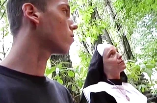 After sex beautiful naked girl in nun costume has fun with a condom