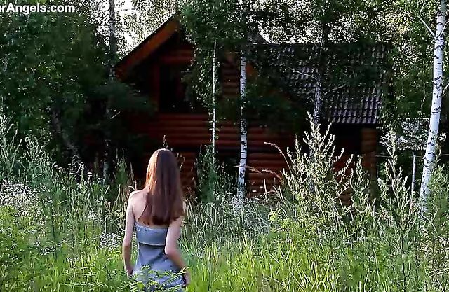 Naked teen girl walks around in the countryside demonstrating her lean body and hairy kitty