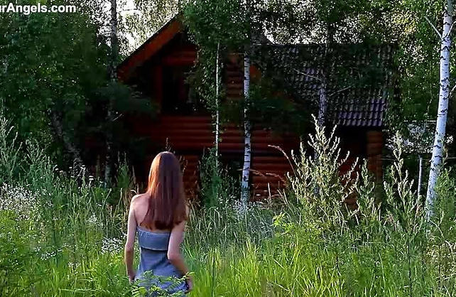 Naked teen girl walks around in the countryside demonstrating her lean body and hairy kitty