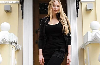 Elegant naked girl with blond hair demonstrates her marvelous curvy body on camera
