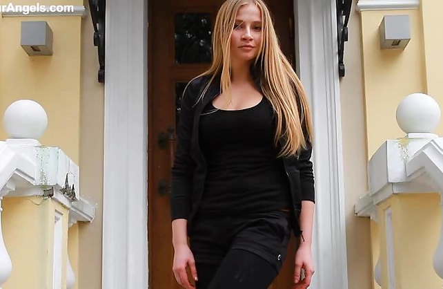 Elegant naked girl with blond hair demonstrates her marvelous curvy body on camera