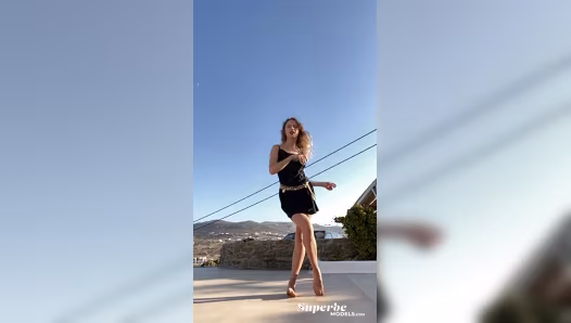 Natural brunette flaunts her naked curves under flowing dress