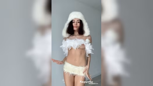 Charming beauty showcases naked slim figure and piercings