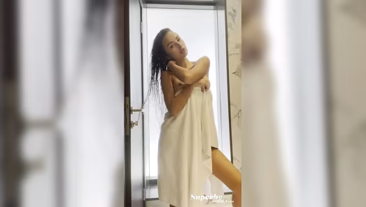 Stunning woman poses completely naked in the bathroom