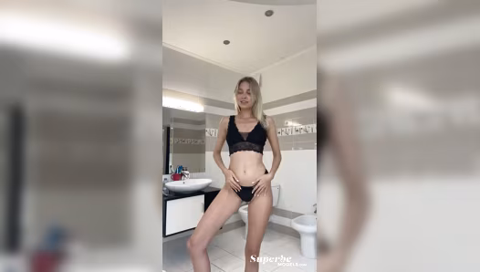 Blonde naked cutie poses for camera