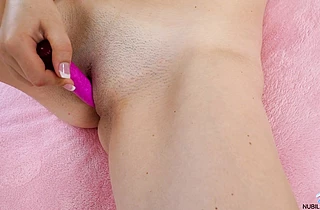 Long-haired nymph gets naked and masturbates hard in order to get orgasm