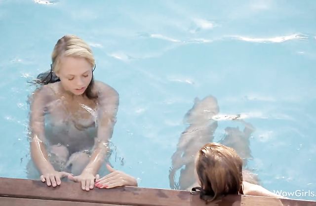 Two horny bitches start eating eachother's pussies on the side of the pool