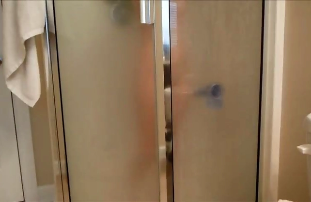 Young naked angel masturbates in the shower using her favorite dildo toy