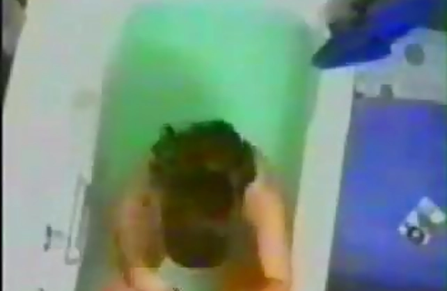 Naked amateur shows slutty solo by masturbating with the shower cap