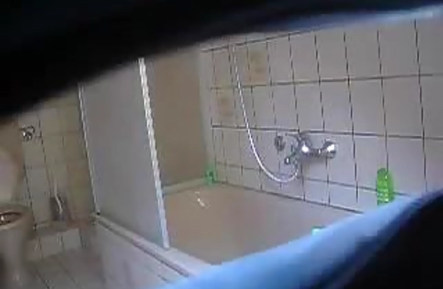 Nude beauty shaves and showers while a horny voyeur is taping her