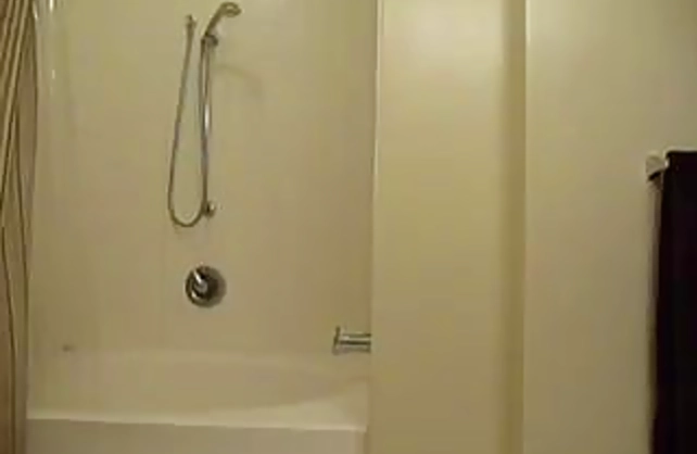 Hot naked babe gets taped when finger fucking pussy under the shower