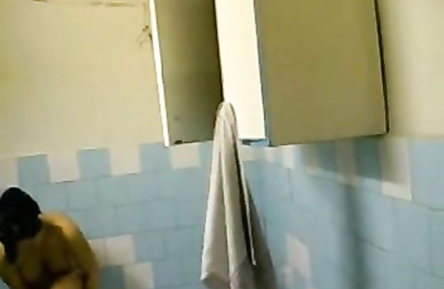 Busty nude girl showers and pleases herself while being filmed