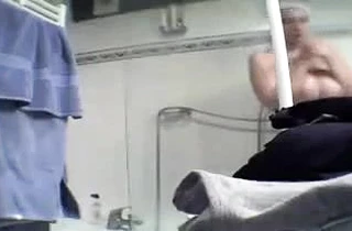 Hot milf with big saggy boobs and hairy pussy relaxes after taking a shower