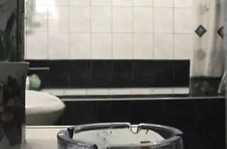 Chubby mature mom masturbates her pussy in the shower and strokes her tits