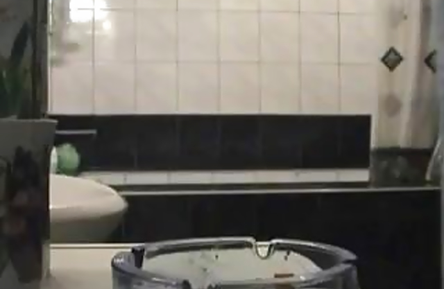 Chubby mature mom masturbates her pussy in the shower and strokes her tits