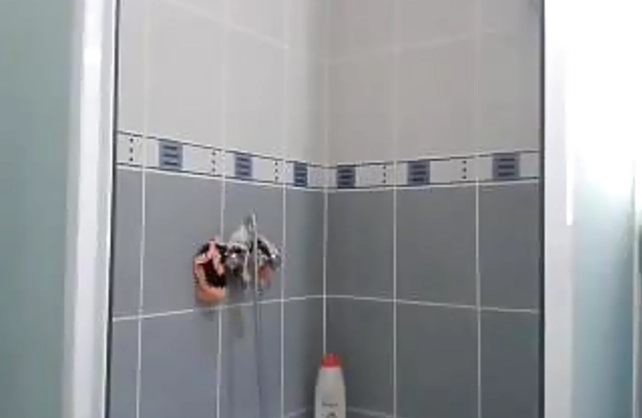 Naked babe with a good body takes off her bikini nicely in the shower