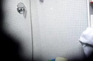 Big assed chick masturbates her hairy pussy while taking a shower