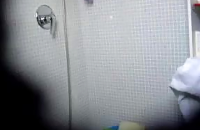 Big assed chick masturbates her hairy pussy while taking a shower