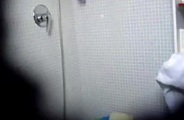 Big assed chick masturbates her hairy pussy while taking a shower