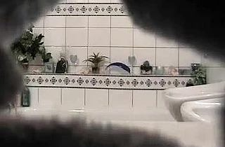 Very sexy naked babe strokes her adorable body in the shower on a hidden cam