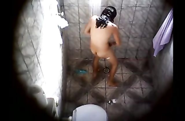 Naked girl rubs her hot body in the shower being watched by a horny voyeur