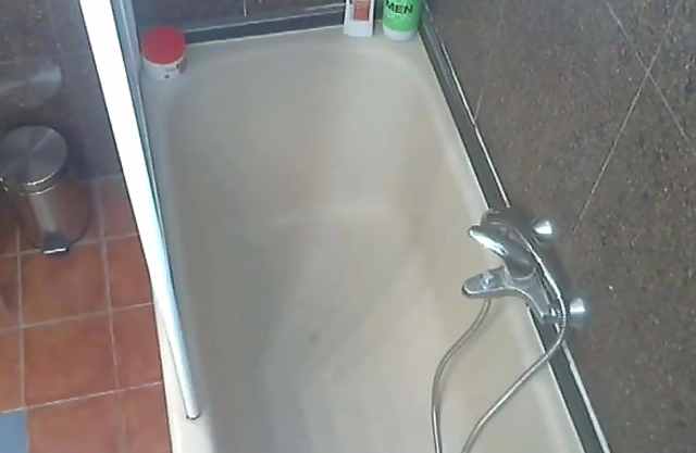 Naked slut goes wild on her shaved pussy while alone in the shower