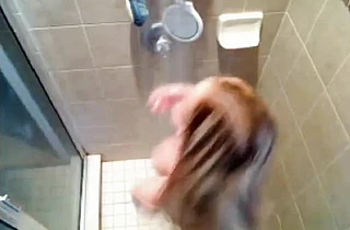 Horny voyeur loves seeing this naked babe bathing and rubbing her tits