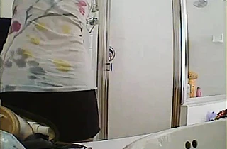 Nude girl gets filmed when walking out of the shower fully exposed