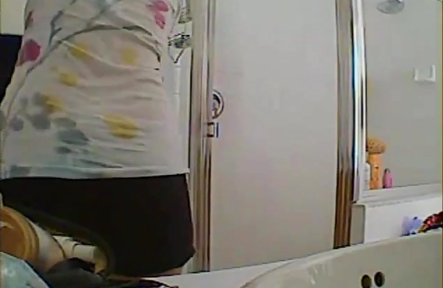 Nude girl gets filmed when walking out of the shower fully exposed