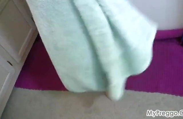 Prego woman shows naked and slutty during a soft solo shower scene