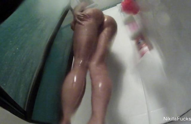 Wet lady with long legs curves and shows off her amazing body in the shower