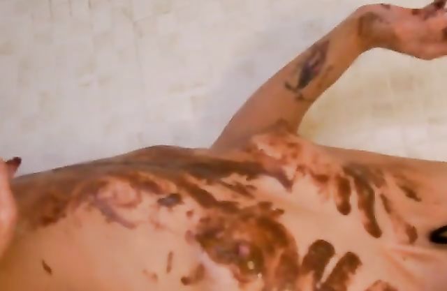 Smeared slut poses on cam in the shower touching her hot tits and pussy