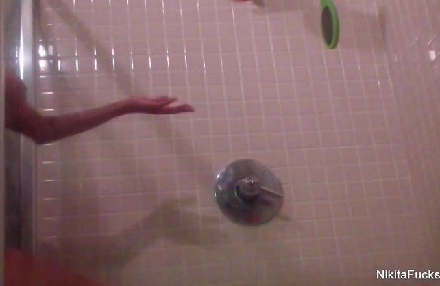 Busty blonde moisturized her body in the shower and plays with her needy pussy