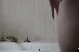 Brunette babe loves to masturbate until she cums in the shower