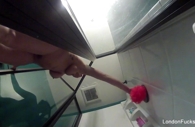 Naked girl rubs her dripping wet body and pussy in the shower on a hidden cam