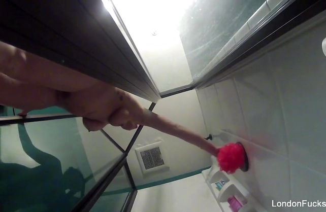 Naked girl rubs her dripping wet body and pussy in the shower on a hidden cam